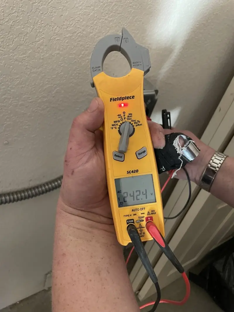 Voltage testing with clamp meter during Electrical Installation Services in Water Valley